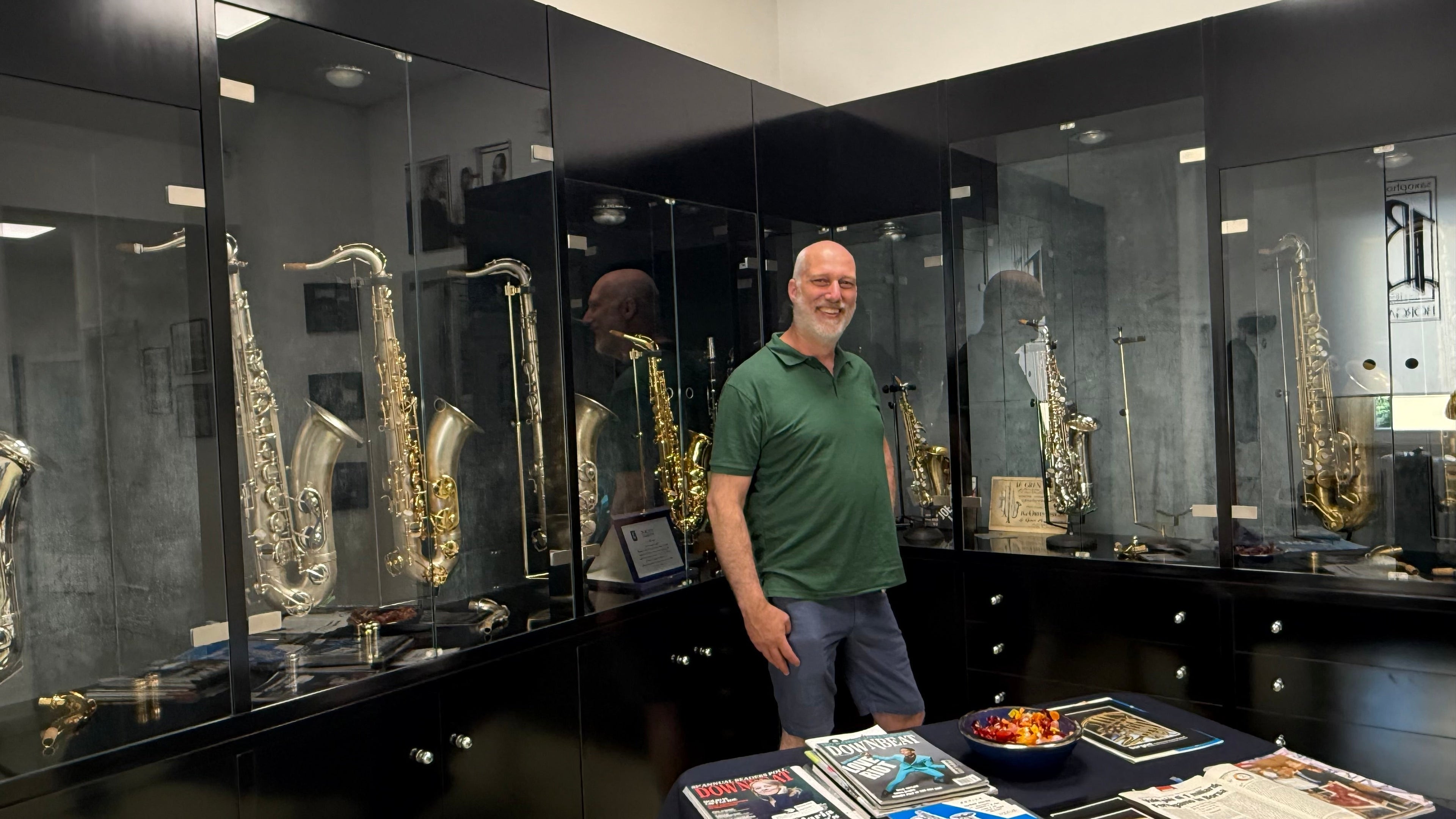 Johan van Buijsen visiting Borgani Instruments showroom in Italy surrounded by vintage and modern saxophones