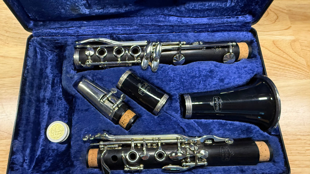     Noblet Paris wooden Bb clarinet displayed in blue lined case