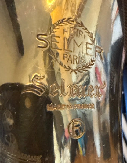 Close-up of the Henri Selmer Paris and Selmer branding engraved on a 1968 Selmer Mark VI tenor saxophone