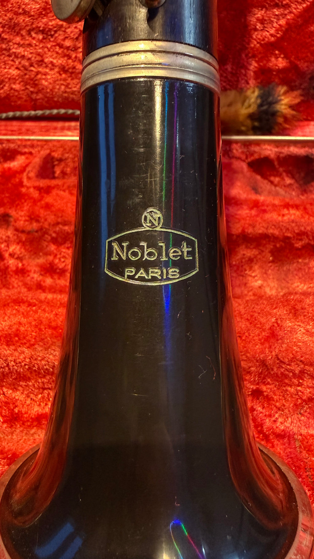 Noblet Paris bell logo on wooden clarinet