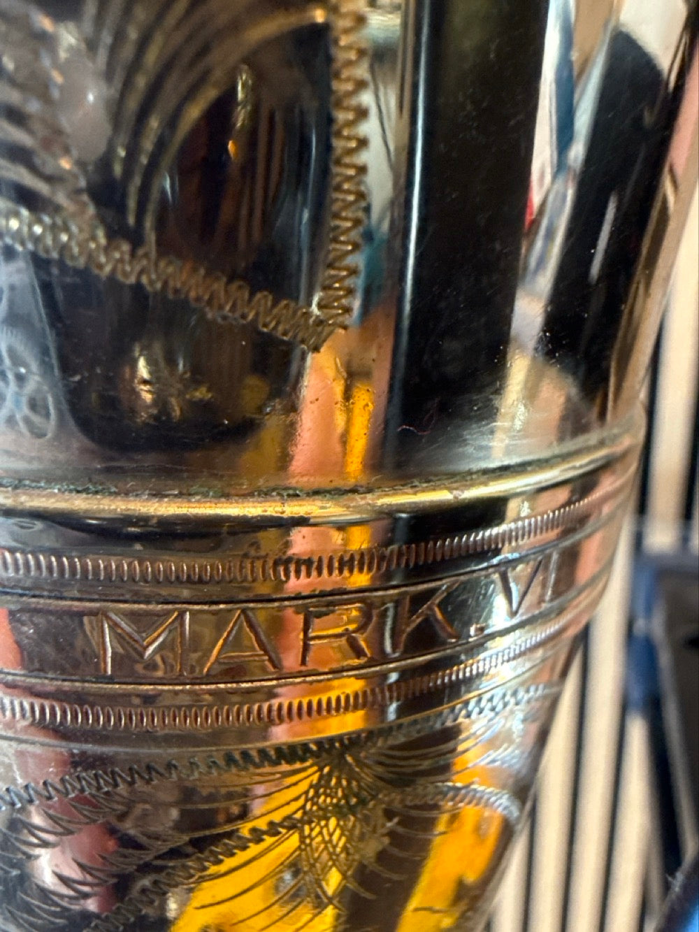 Close-up of the original Selmer Mark VI engraving and gold lacquer on a 1968 tenor saxophone