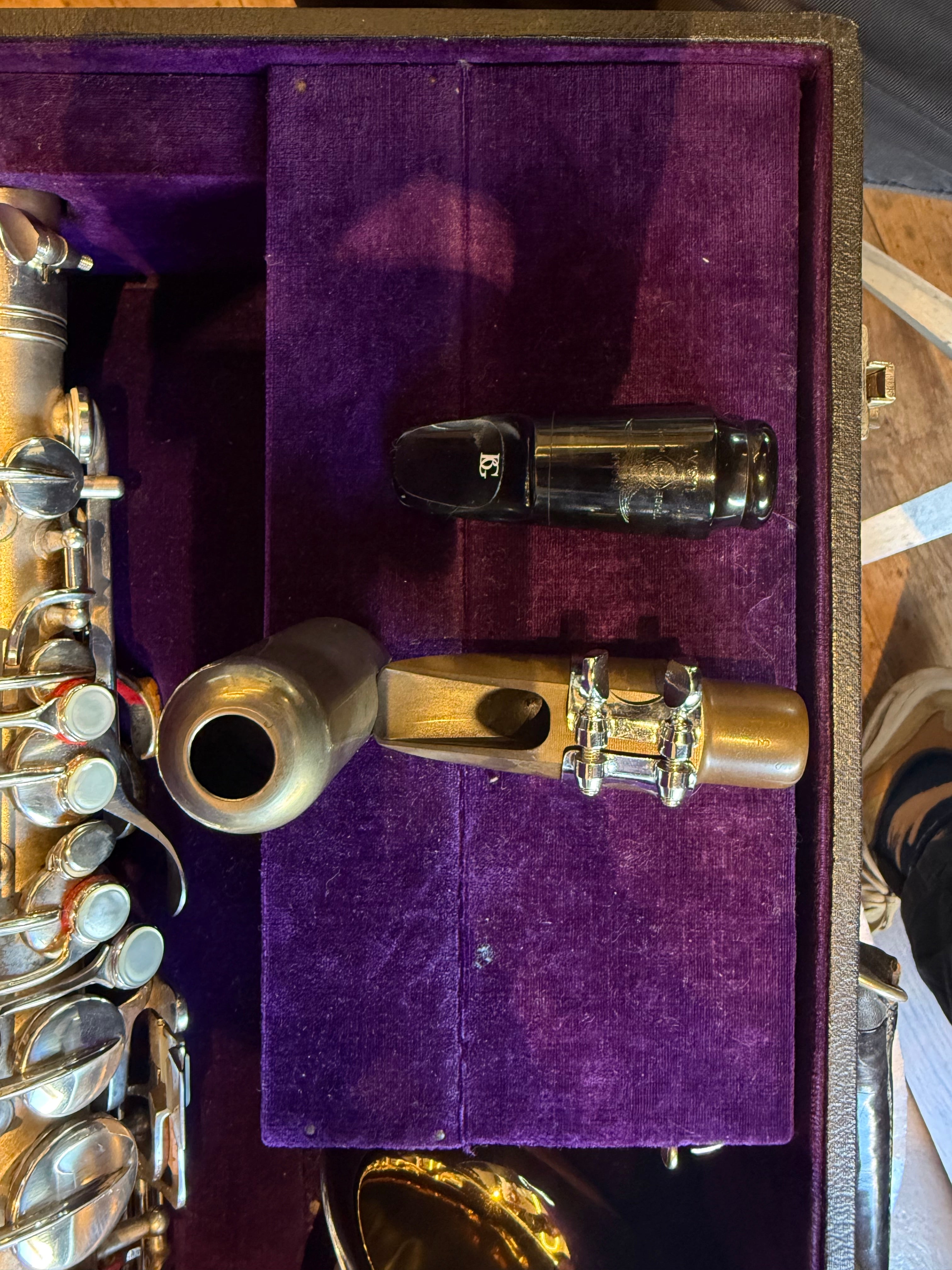 Conn saxophone mouthpiece with ligature close-up