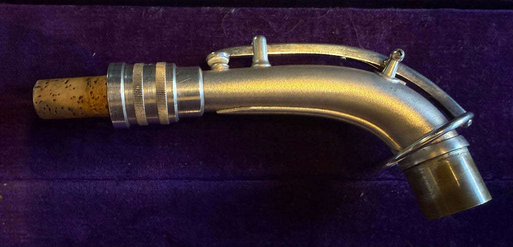 Conn saxophone neck with cork and mechanism detail