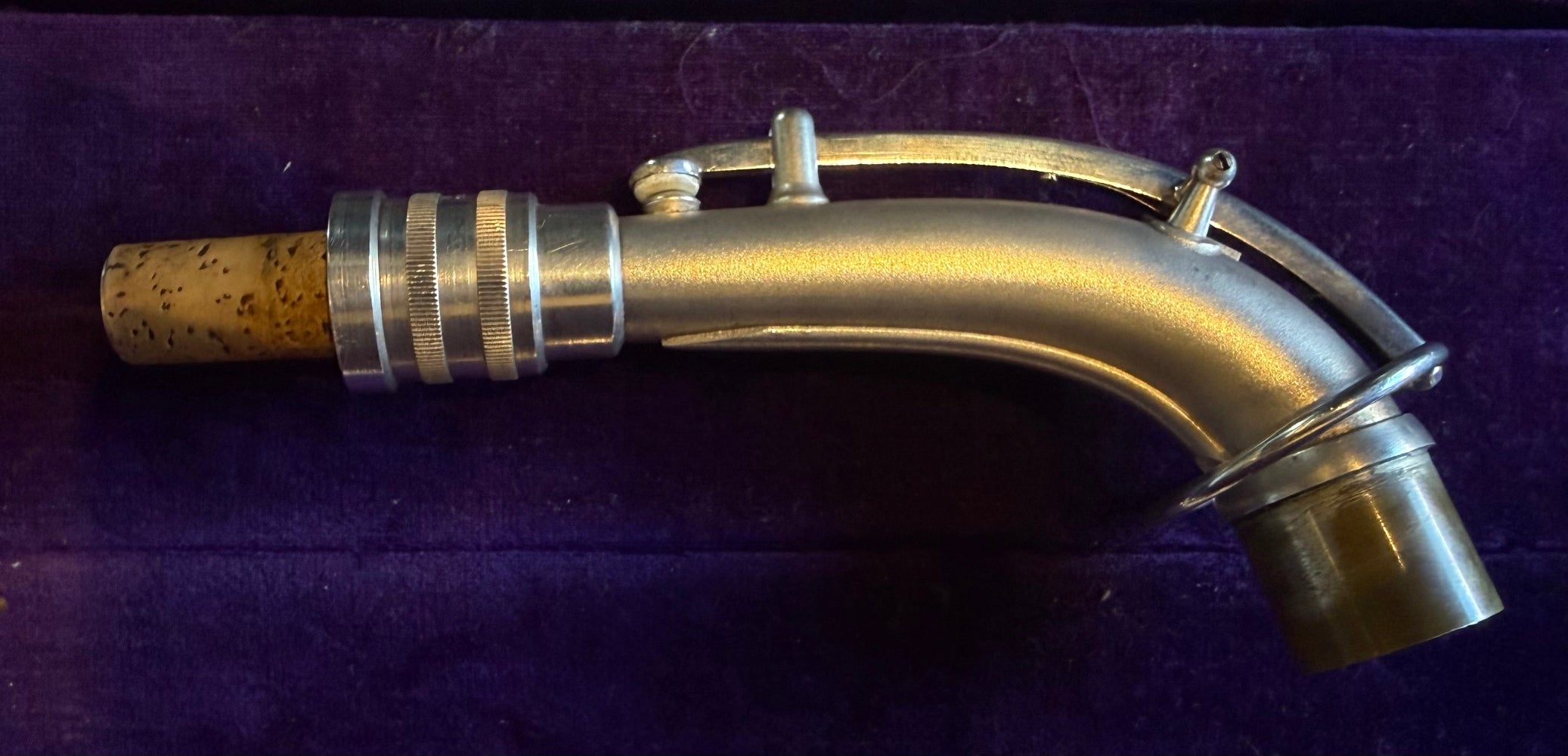 Conn saxophone neck with cork and mechanism detail