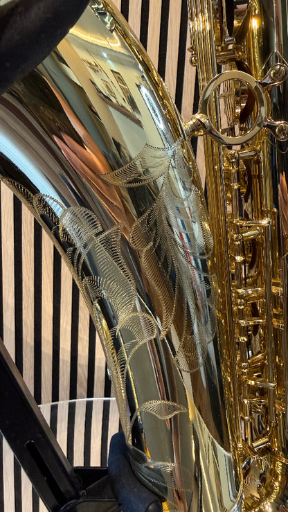 Selmer Super Action 80 Series II tenor saxophone in gold lacquer – close-up of detailed floral bell engraving and side keywork
