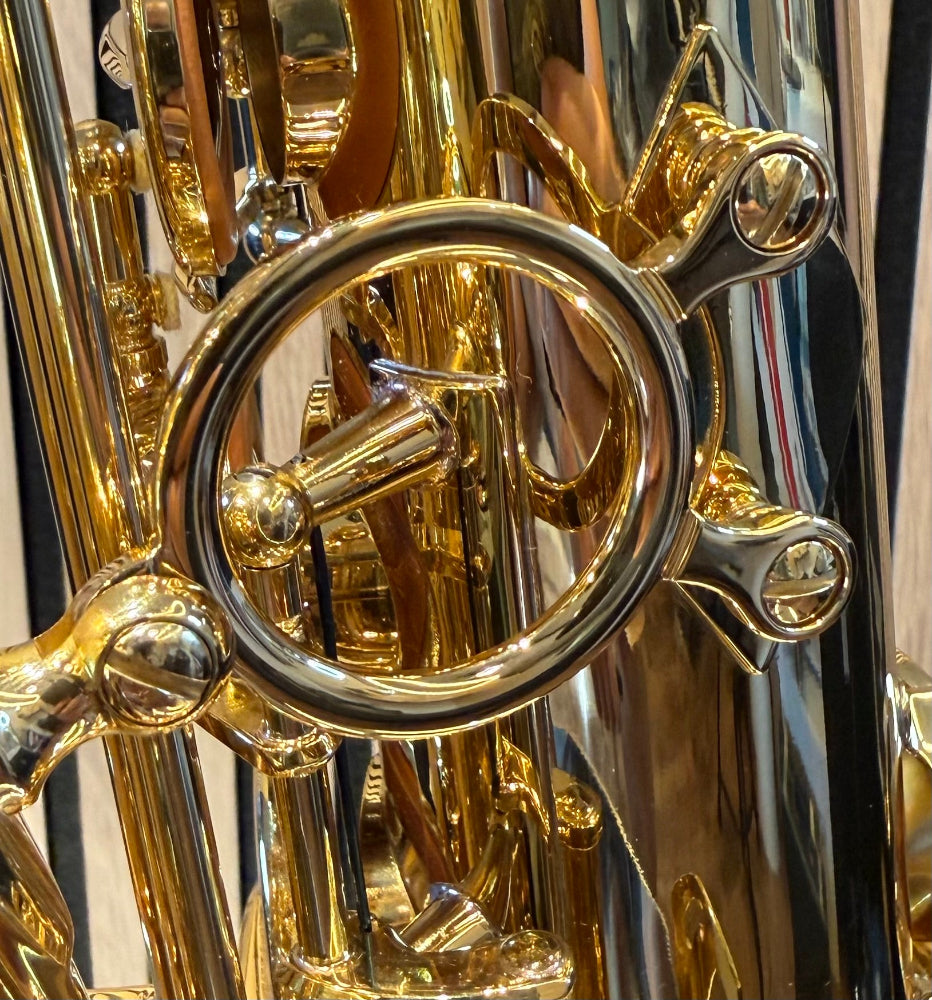 Trevor James The Horn tenor saxophone in gold lacquer – close-up of decorative bell brace and keywork

