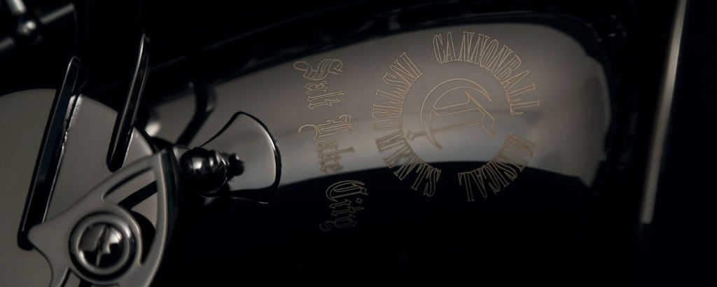 Close-up of Cannonball A4-B bell engraving in polished black nickel finish